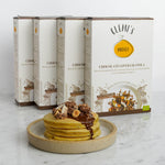quattro confezioni affiancate di granola bio vegan con fiocchi d'avena, cioccolato e nocciole