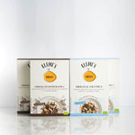 quattro confezioni affiancate di granola mista orginal e al cioccolato bio e vegan